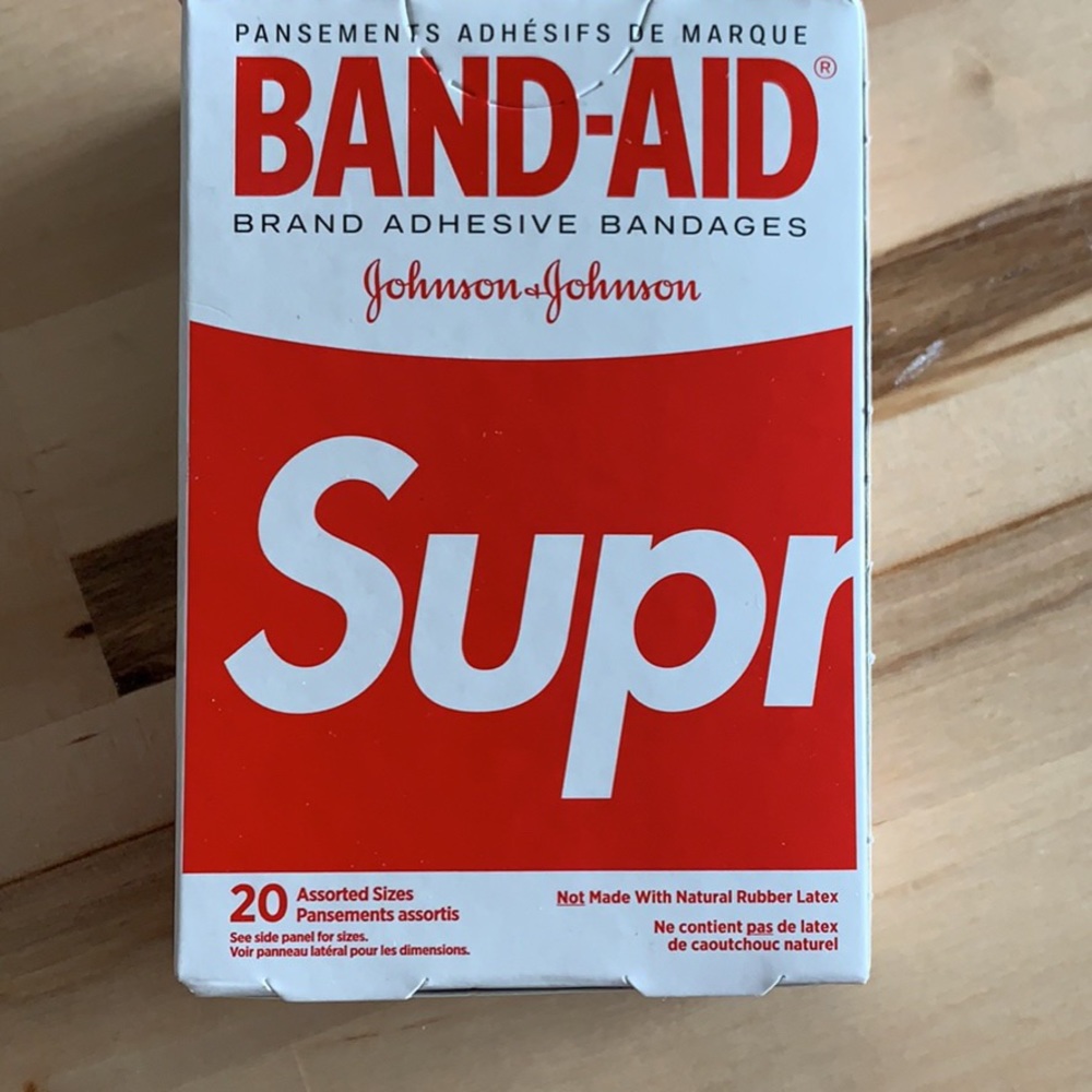 Brand new box of supreme band aids .